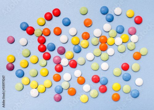 lollipops, candy, top view flat lay on blue background