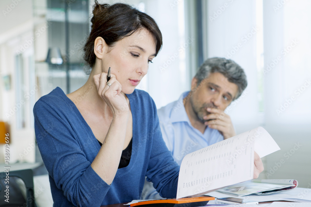 Fototapeta premium Couple doing paperwork