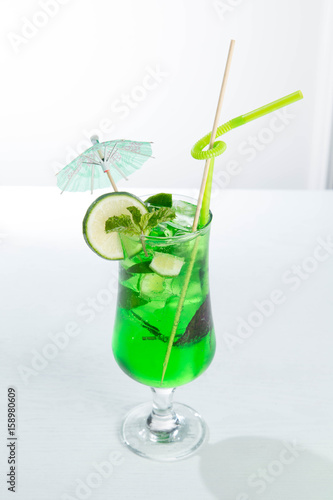 Lemonade tarhun or estragon with ice and lime on white background