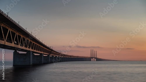 Time lapse of sun setting over the Oresund bridge photo