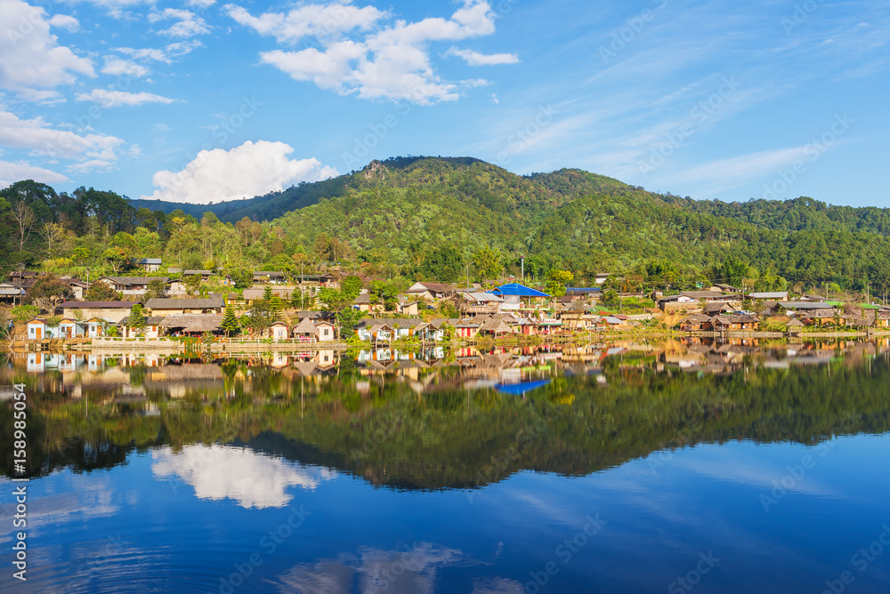 Beautiful lake and sky view of the Rak Thai village and mountain reflection in Pai district, Mae Hong Son Province, Thailand. 