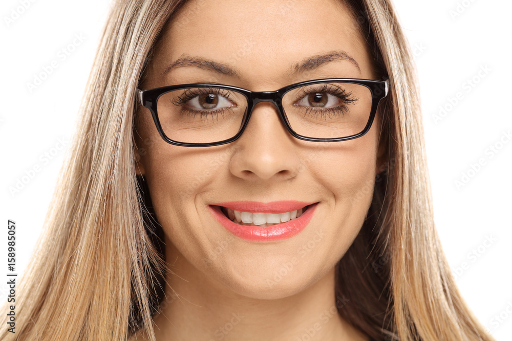 Close-up of a woman wearing eyeglasses and smiling