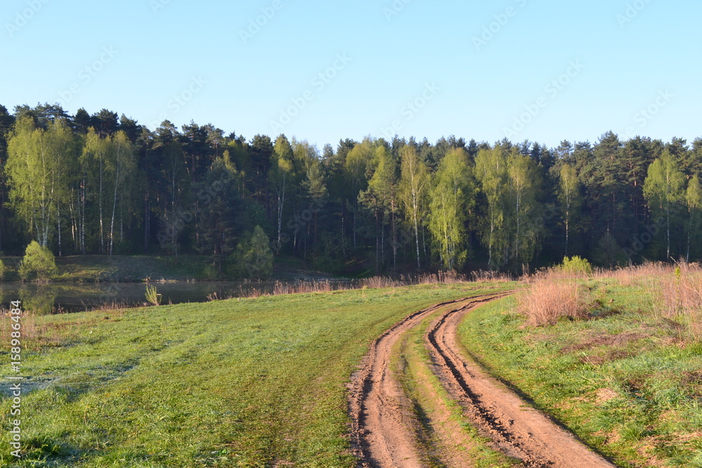 Russian rural landscape with empty dirt road