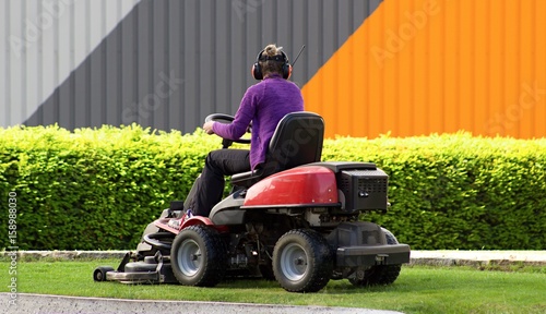 Woman with garden lawn mower