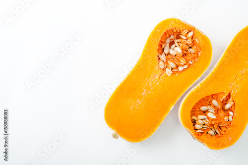 Tableau sur toile Butternut squash halved on white background with copy space