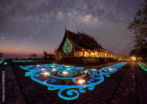 Temple Sirindhorn Wararam Phuproud in Ubon Ratchathani Province at night and The Milky Way is our galaxy. This long exposure astronomical © tope007
