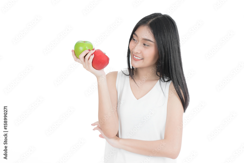 Smiling Asian woman with healthy teen holding red and green apples. white undershirt. isolated portrait. Smiling Asian woman with healthy teen holding red and green apples. white undershirt. isolated portrait.