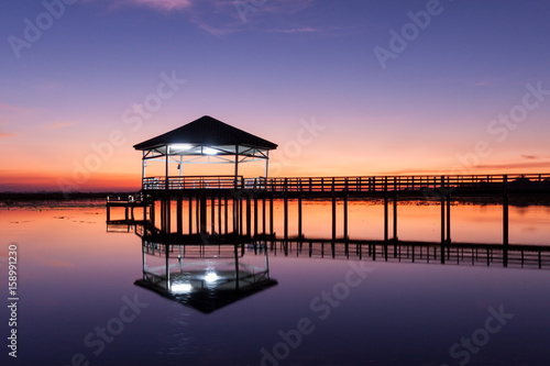 Sunset  Twilight at the reservoir with pavilion Silhouette. Bueng Si Fai Phichit. 