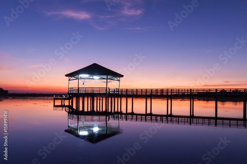 Sunset, Twilight at the reservoir with pavilion,Silhouette.(Bueng Si Fai Phichit.) © ja9pai