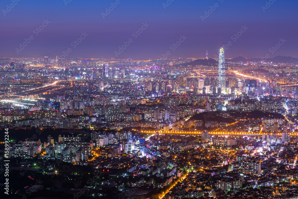 Seoul city and downtown skyline and skyscraper at night, The best view of South Korea with Lotte world mall at Namhansanseong Fortress.