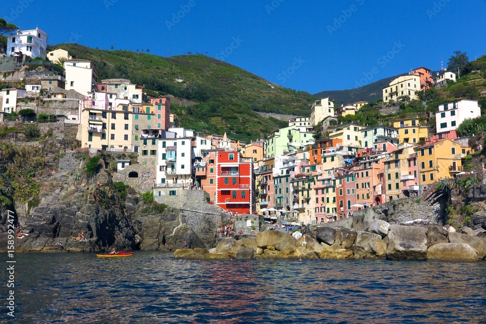 Riomaggiore harbor with colorful buildings on Italy’s Cinque Terre coast
