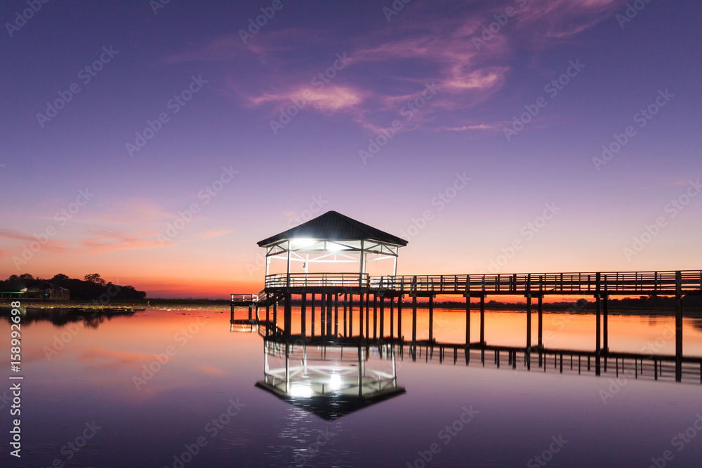 Sunset, Twilight at the reservoir with pavilion,Silhouette.(Bueng Si Fai Phichit.)
