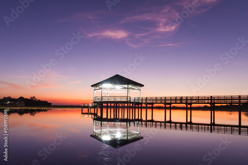 Sunset, Twilight at the reservoir with pavilion,Silhouette.(Bueng Si Fai Phichit.)