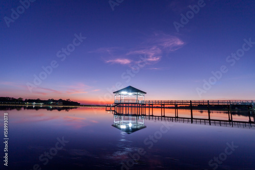 Fototapeta Naklejka Na Ścianę i Meble -  Sunset, Twilight at the reservoir with pavilion,Silhouette.(Bueng Si Fai Phichit.)