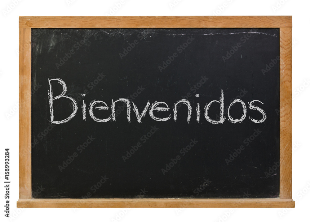 Bienvenidos written in white chalk on a black chalkboard isolated on white Bienvenidos written in white chalk on a black chalkboard isolated on white