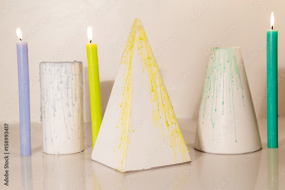 Colorful drops of wax on geometric shapes Colorful drops of wax on geometric shapes