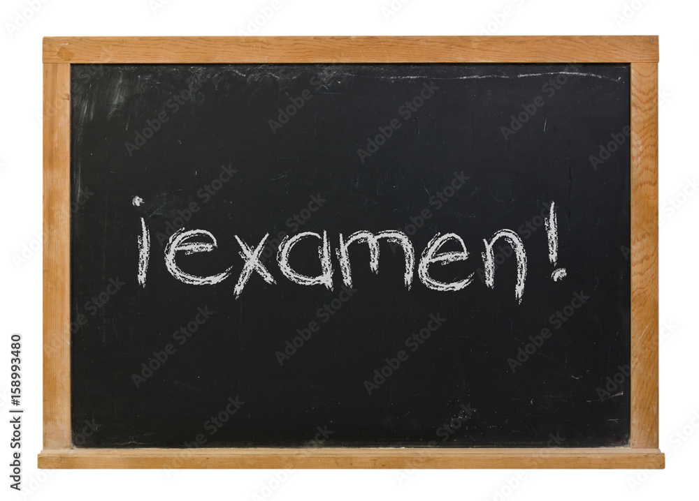 Exam written in Spanish in white chalk on a black chalkboard isolated on white Exam written in Spanish in white chalk on a black chalkboard isolated on white