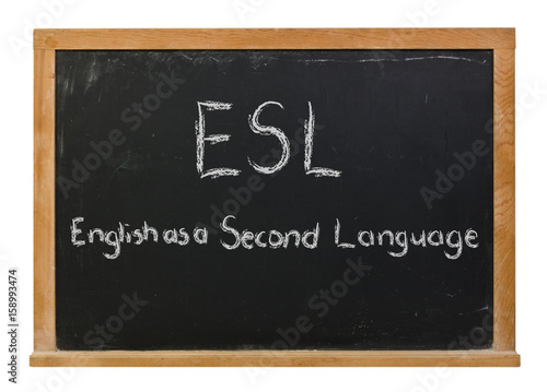 ESL English as a second language written in white chalk on a black chalkboard isolated on white photo