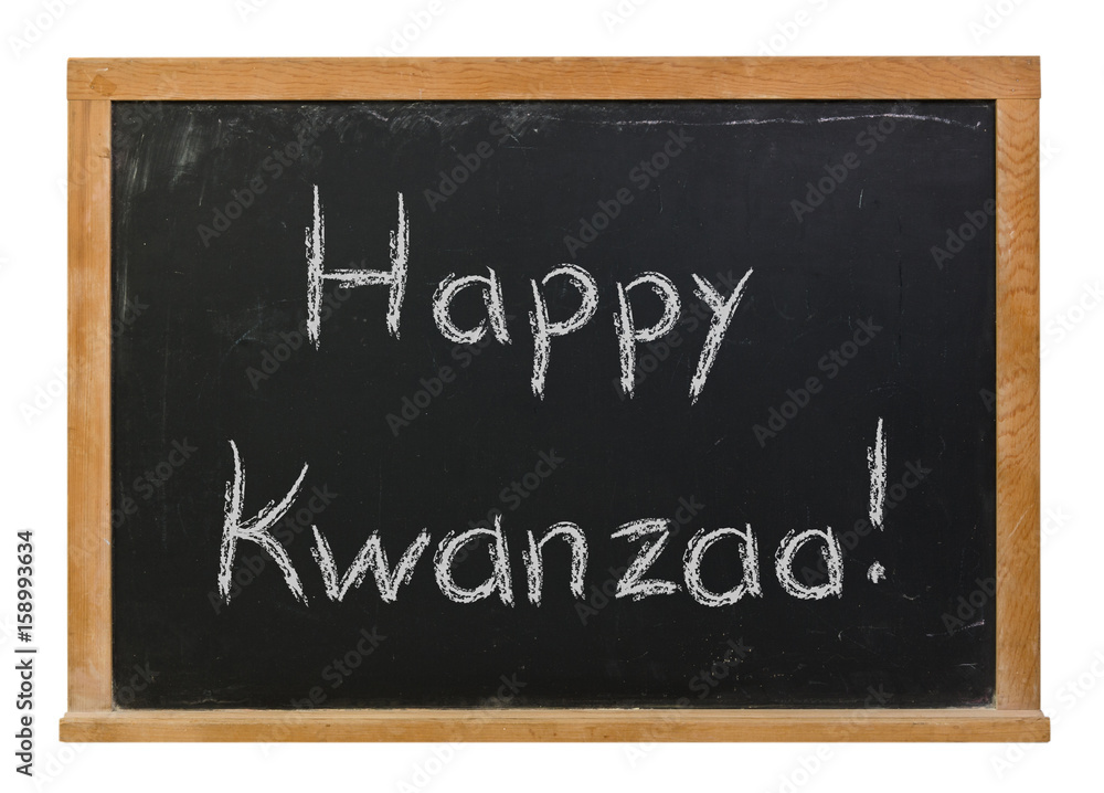 Fototapeta premium Happy Kwanzaa written in white chalk on a black chalkboard isolated on white