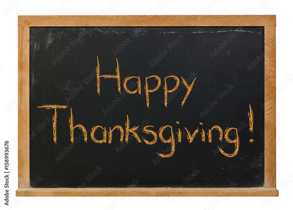 Obraz premium Happy Thanksgiving written in orange chalk on a black chalkboard isolated on white
