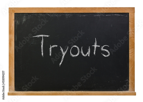 Tryouts written in white chalk on a black chalkboard isolated on white