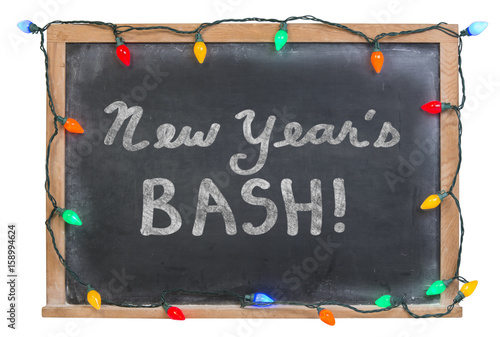 Fotografía New Year's bash written in white chalk on a black chalkboard surrounded with fes