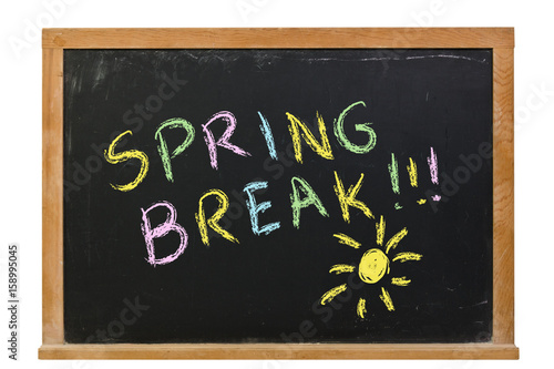 Photography Spring Break with a sun written in colorful chalk on a black chalkboard isolated
