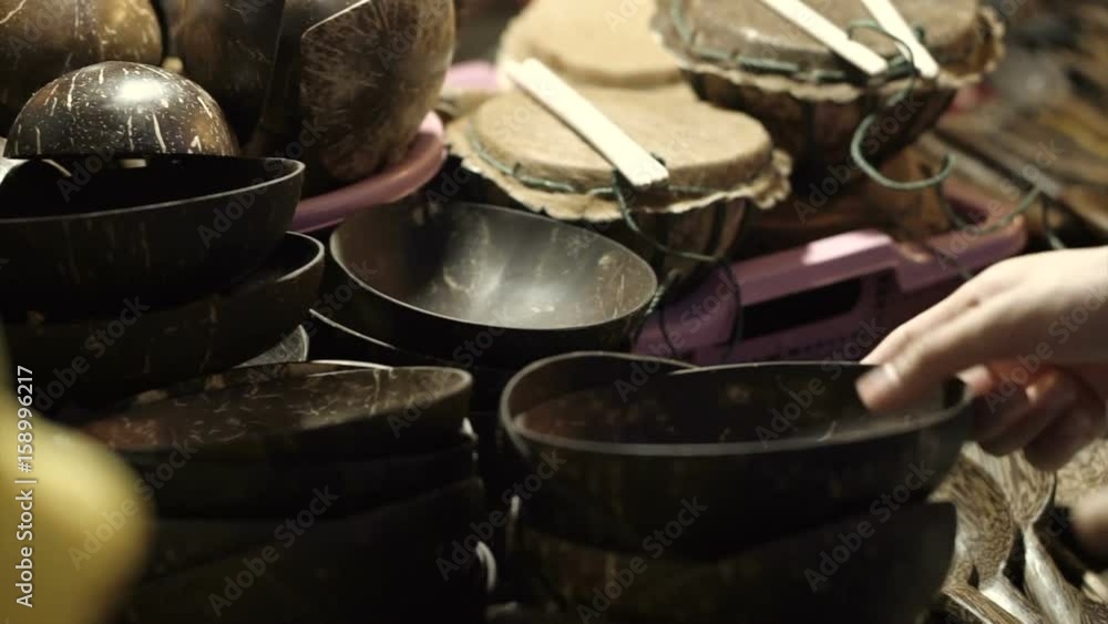 Hand picking some wood hand craft products from local night market Hand picking some wood hand craft products from local night market