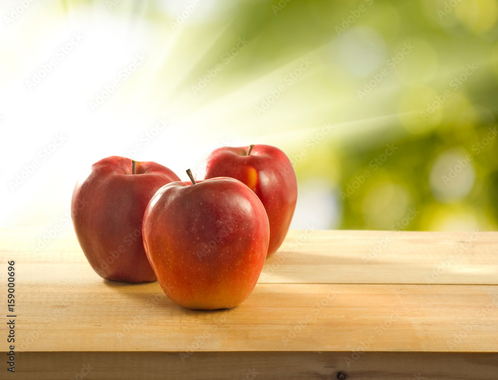 image of apples on a green background image of apples on a green background