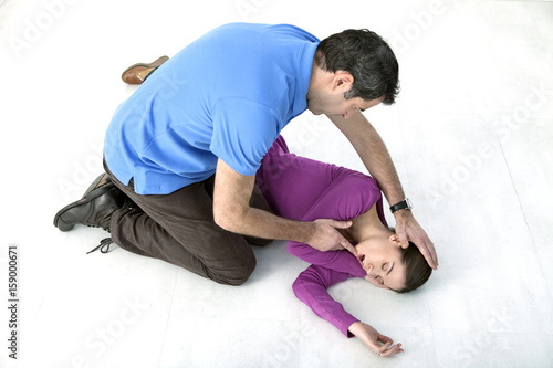 First aid techniques : placing the victim in the recovery position Step 5 : Open the victim's mouth to allow any liquid to drain outwards Check that breathing is normal