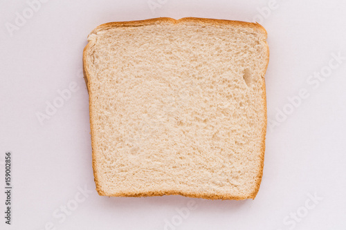 Slice of white bread on white background