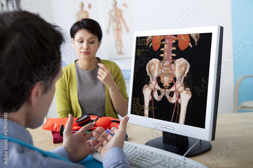 Models On screen, 3D angiography scanner Study of the blood vascularization (anterior view focused on the abdomen and pelvis) Visualization of the bone skeleton, aorta and its ramifications, kidneys and their vascularization (renal arteries and left renal vein) as well as vessels of lower limbs (iliac and femoral arteries and veins) photo