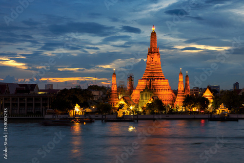 Twilight time of Wat Arun across Chao Phraya River in Bangkok, Thailand