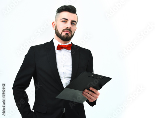 Stylish presenter with beard and fashionable hairdo in classic suit