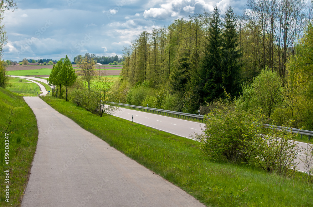 An empty road in the summer time. Image has a vintage effect. An empty road in the summer time. Image has a vintage effect.