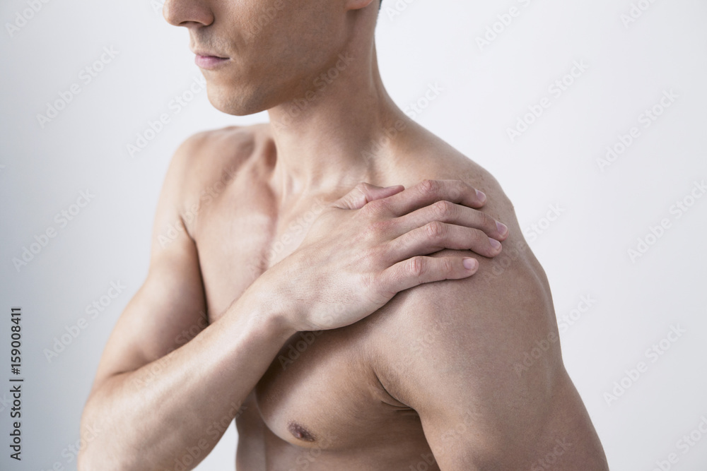 Naklejka premium Shoulder pain in a man