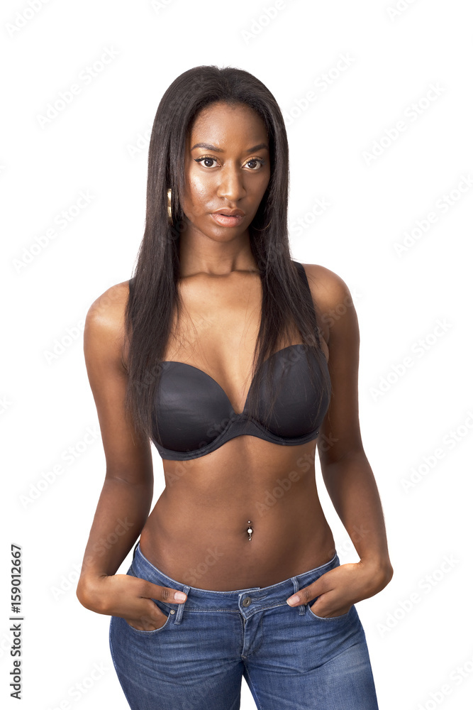 Young african american woman posing wearing jeans and her bra