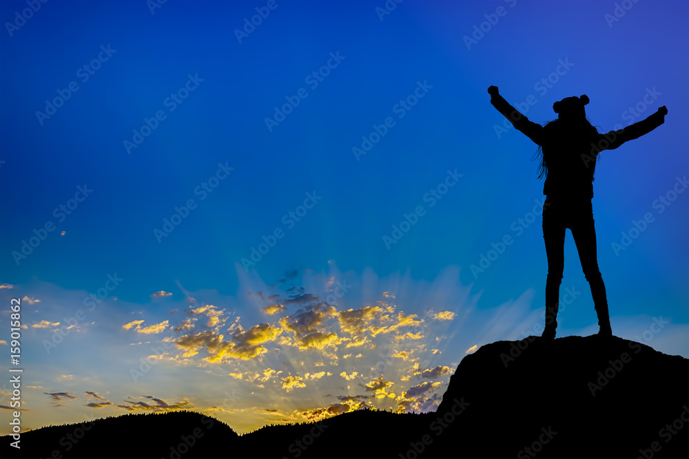 silhouette achievements successful arm up girl is on top of hill celebrating success with sunset