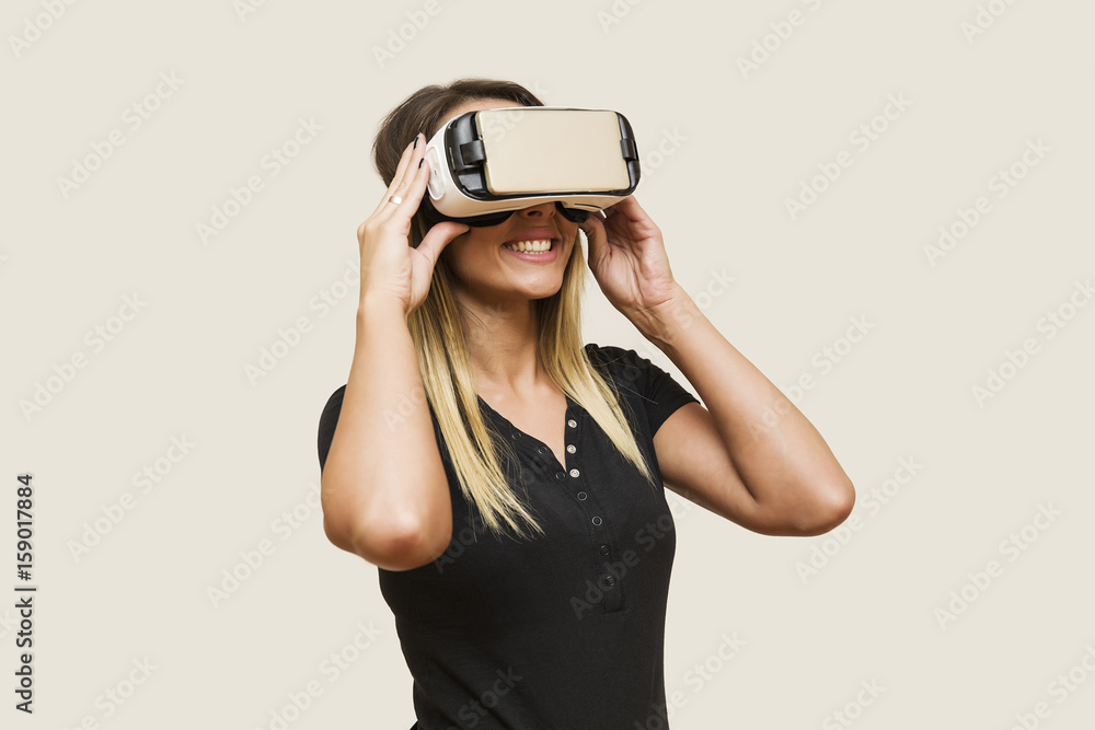 Young woman looking via virtual reality device Young woman looking via virtual reality device