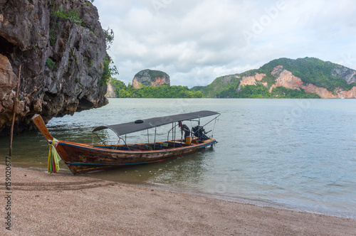 Longtail boat on the shore of James Bond Island in Thailand