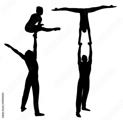 Gymnasts acrobats vector black silhouette on black background. Gymnasts acrobats vector 