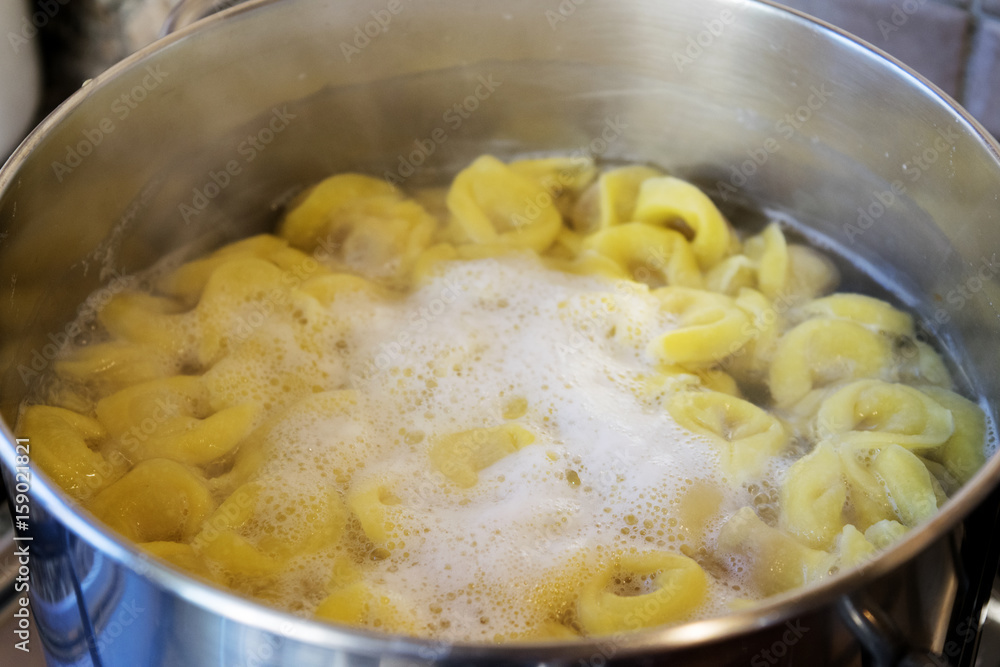 tortellini cooking in boiling water tortellini cooking in boiling water