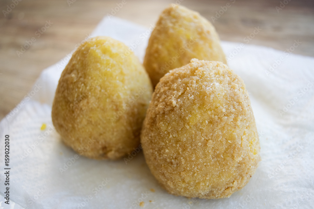 sicilian arancine fried in boiling oil sicilian arancine fried in boiling oil