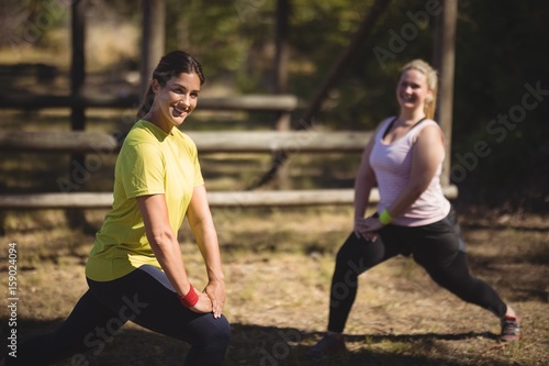 Women exercising during obstacle course