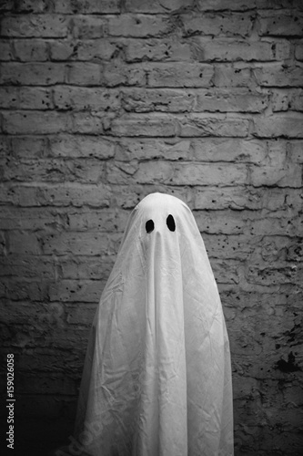 Little boy in halloween ghost costume