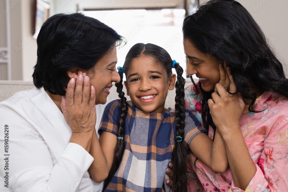 Portrait of cute smiling girl with mother and grandmother Portrait of cute smiling girl with mother and grandmother