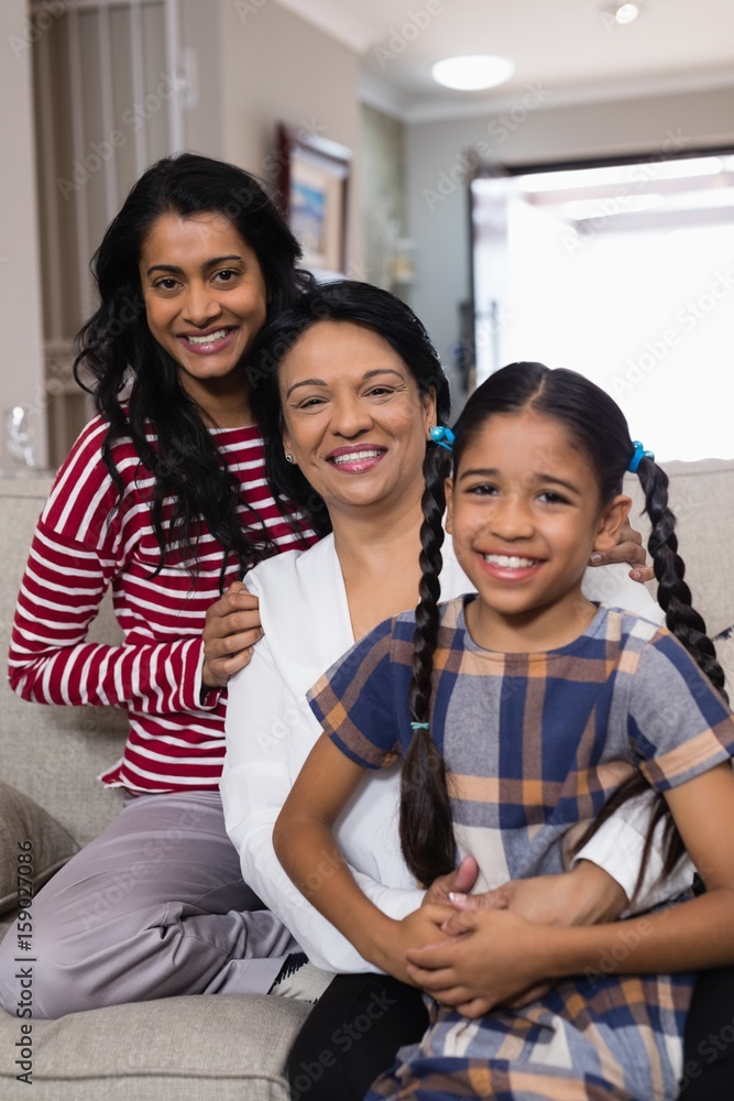 Fototapeta premium Portrait of smiling multi-generation family in row