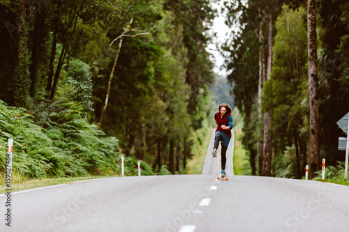 Wallpaper Mural A man rushes on a skateboard down an open road in New Zealand Torontodigital.ca