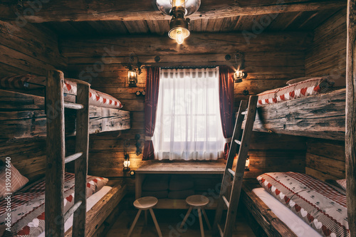 four bed room with rustic wooden bunk beds photo