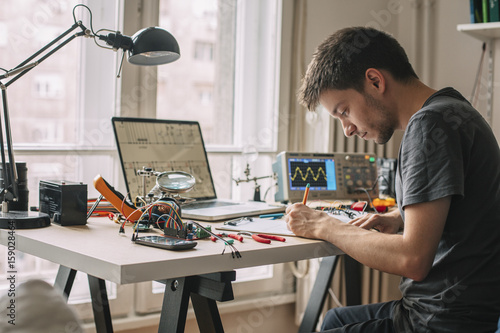 Engineer Testing Equipment at Home